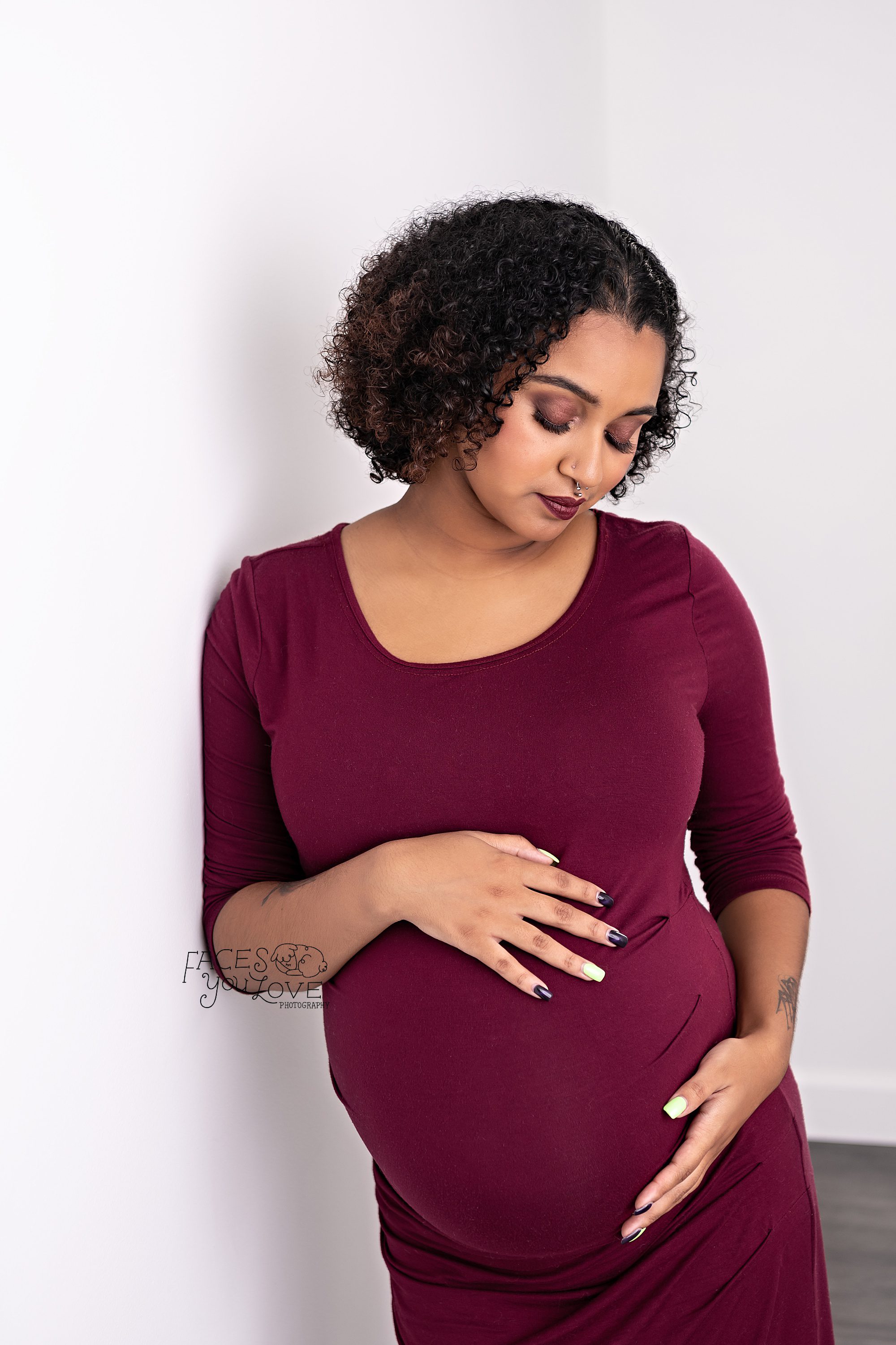 glam maternity makeup, glam makeup, contemplative maternity, expectant mom looking down, maternity studio portraits, Kansas City photographer