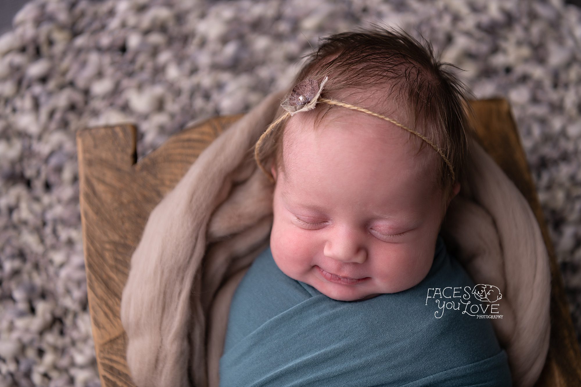 wrapped newborn pose, newborn mini session, smiling newborn, newborn photography studio Kansas City