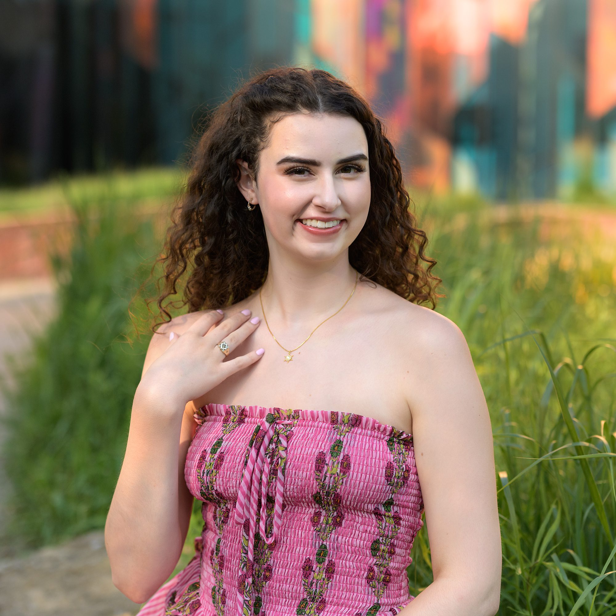 Portrait of a high school senior girl, in front of the Prairiefire Museum in Overland Park, photographed by Helen Ransom.